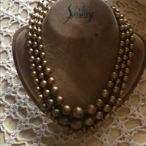 Gold tone bead tier necklace